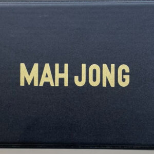 Travel Mahjong in a black vinyl case with Racks